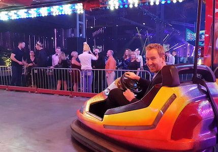 Alex Ashman, director of magic42, in a bumper car
